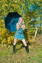 Beautiful young woman posing near a tree Royalty Free Stock Photo