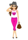Beautiful young woman posing in sunglasses, hat, handbag and sleeveless T-shirt with heart Royalty Free Stock Photo