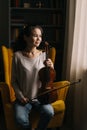 Beautiful young woman posing with a violin in her hand Royalty Free Stock Photo