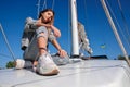 Beautiful young woman posing on yacht. Model is sailing on board Royalty Free Stock Photo