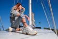 Beautiful young woman posing on yacht. Model is sailing on board Royalty Free Stock Photo