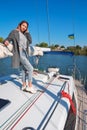 Beautiful young woman posing on yacht. Model is sailing on board Royalty Free Stock Photo