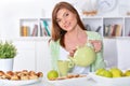 Portrait of beautiful young woman pouring tea in cup Royalty Free Stock Photo