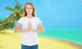 Beautiful young woman practicing yoga in the beach tropical and making namaste mudra Royalty Free Stock Photo