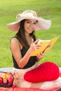 Beautiful young woman reading book at park Royalty Free Stock Photo