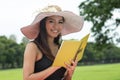 Beautiful young woman reading book at park Royalty Free Stock Photo