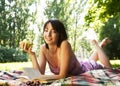 Beautiful young woman reading outdoor Royalty Free Stock Photo