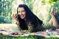 Beautiful young woman reading outdoor Royalty Free Stock Photo