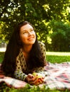 Beautiful young woman reading outdoor Royalty Free Stock Photo