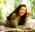 Beautiful young woman reading outdoor Royalty Free Stock Photo