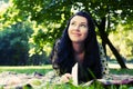 Beautiful young woman reading outdoor Royalty Free Stock Photo