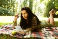 Beautiful young woman reading outdoor Royalty Free Stock Photo