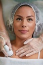 Beautiful young woman receiving cavitation treatment skin Royalty Free Stock Photo