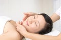 Beautiful young woman receiving facial massage Royalty Free Stock Photo