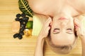 Beautiful young woman receiving facial massage at a spa salon Royalty Free Stock Photo