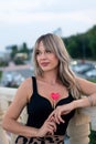 Beautiful young woman with red heart shaped lollipop Royalty Free Stock Photo