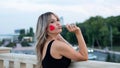 Beautiful young woman with red heart shaped lollipop Royalty Free Stock Photo