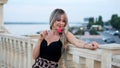 Beautiful young woman with red heart shaped lollipop Royalty Free Stock Photo