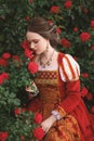 Medieval young woman with roses Royalty Free Stock Photo