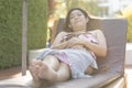 Beautiful young woman relaxing on beach chair Royalty Free Stock Photo