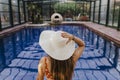 beautiful young woman relaxing in an indoor swimming pool. Summer time and lifestyle Royalty Free Stock Photo