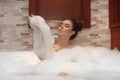 Beautiful Young woman relaxing in jacuzzi bath spa, Attractive g Royalty Free Stock Photo