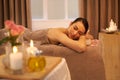 Enjoying a slice of utopia. A beautiful young woman relaxing on a massage table before her massage.