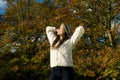 Beautiful young woman relaxing outdoors and enjoying a sunny autumn day Royalty Free Stock Photo