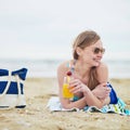 Woman relaxing and sunbathing on beach Royalty Free Stock Photo