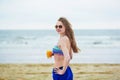 Beautiful young woman relaxing and sunbathing on beach Royalty Free Stock Photo