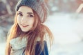 Beautiful young woman relaxing on winter walk in snowy forest, candid capture Royalty Free Stock Photo