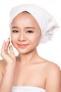 Beautiful young woman removing face make up with cotton pad Royalty Free Stock Photo