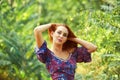 Beautiful young woman resting in summer Park , enjoying nature outdoors. Royalty Free Stock Photo