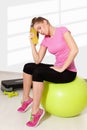 Beautiful young woman resting after tiring workout Royalty Free Stock Photo