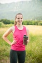 Beautiful young woman rests after a long run workout outdoor in nature Royalty Free Stock Photo