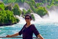 Beautiful young woman in Rhine falls in Switzerland Royalty Free Stock Photo