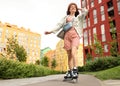 Beautiful young woman with roller skates having fun outdoors Royalty Free Stock Photo