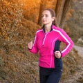 Beautiful young woman running at the lake Royalty Free Stock Photo