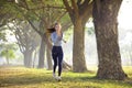 Beautiful young woman running in the park at  morning Royalty Free Stock Photo