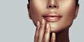 Beautiful young woman`s lips closeup. Plastic surgery, fillers, injection. Model girl`s face, healthy nails, and perfect skin