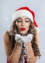 Beautiful young woman in a Santa Claus hat. Royalty Free Stock Photo