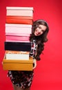 Beautiful young woman with shopping bags and boxes isolated on pink. Royalty Free Stock Photo