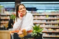 Beautiful young woman shopping for cereal, bulk in a grocery supermarket Royalty Free Stock Photo