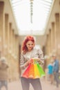 Beautiful young woman shopping in the city, mall with shopping bag Royalty Free Stock Photo