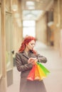 Beautiful young woman shopping in the city, mall with shopping bag Royalty Free Stock Photo