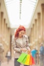 Beautiful young woman shopping in the city, mall with shopping bag Royalty Free Stock Photo
