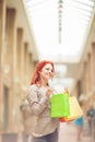 Beautiful young woman shopping in the city, mall with shopping bag Royalty Free Stock Photo