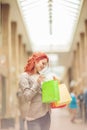 Beautiful young woman shopping in the city, mall with shopping bag Royalty Free Stock Photo