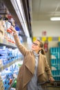 Beautiful young woman shopping for groceries