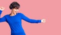 Beautiful young woman with short hair wearing training workout clothes dancing happy and cheerful, smiling moving casual and Royalty Free Stock Photo